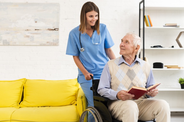 old-man-sitting-wheelchair-while-talking-nurse_23-2148239022